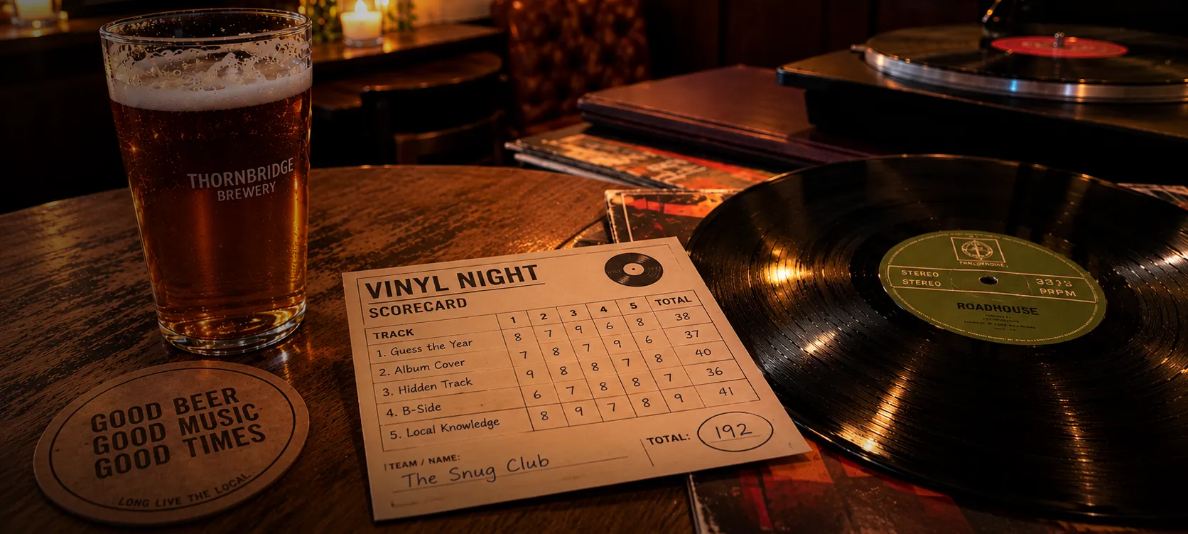 A pint of beer, a vinyl night scorecard and a record on a pub table